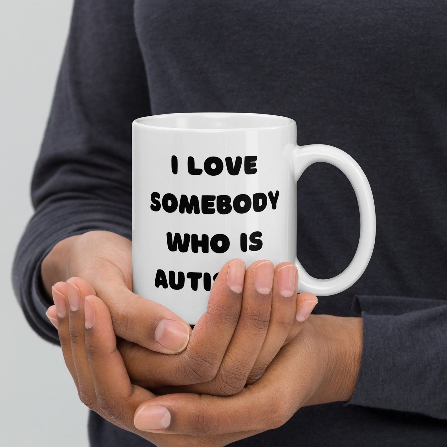 I love somebody who is autistic! White glossy mug