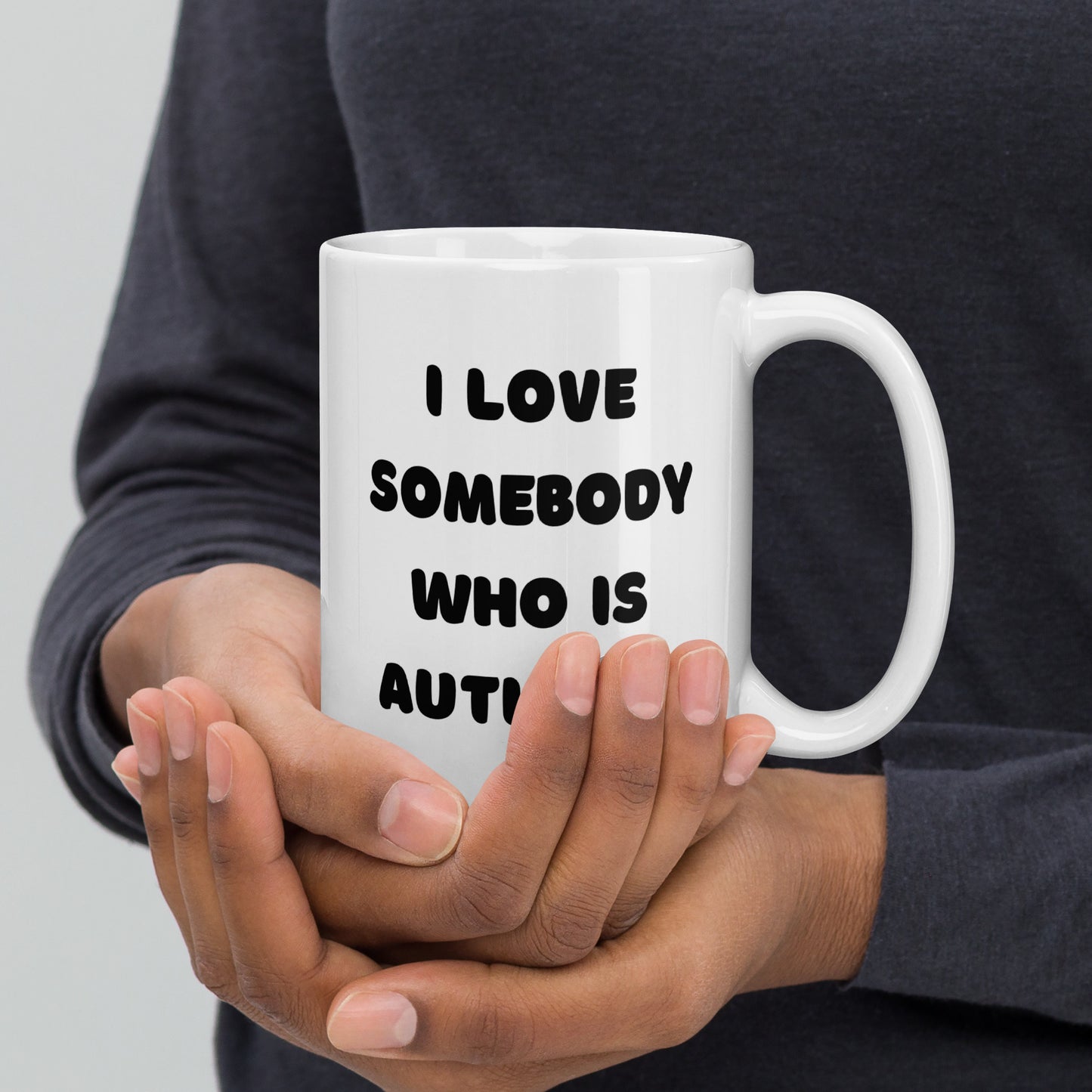 I love somebody who is autistic! White glossy mug